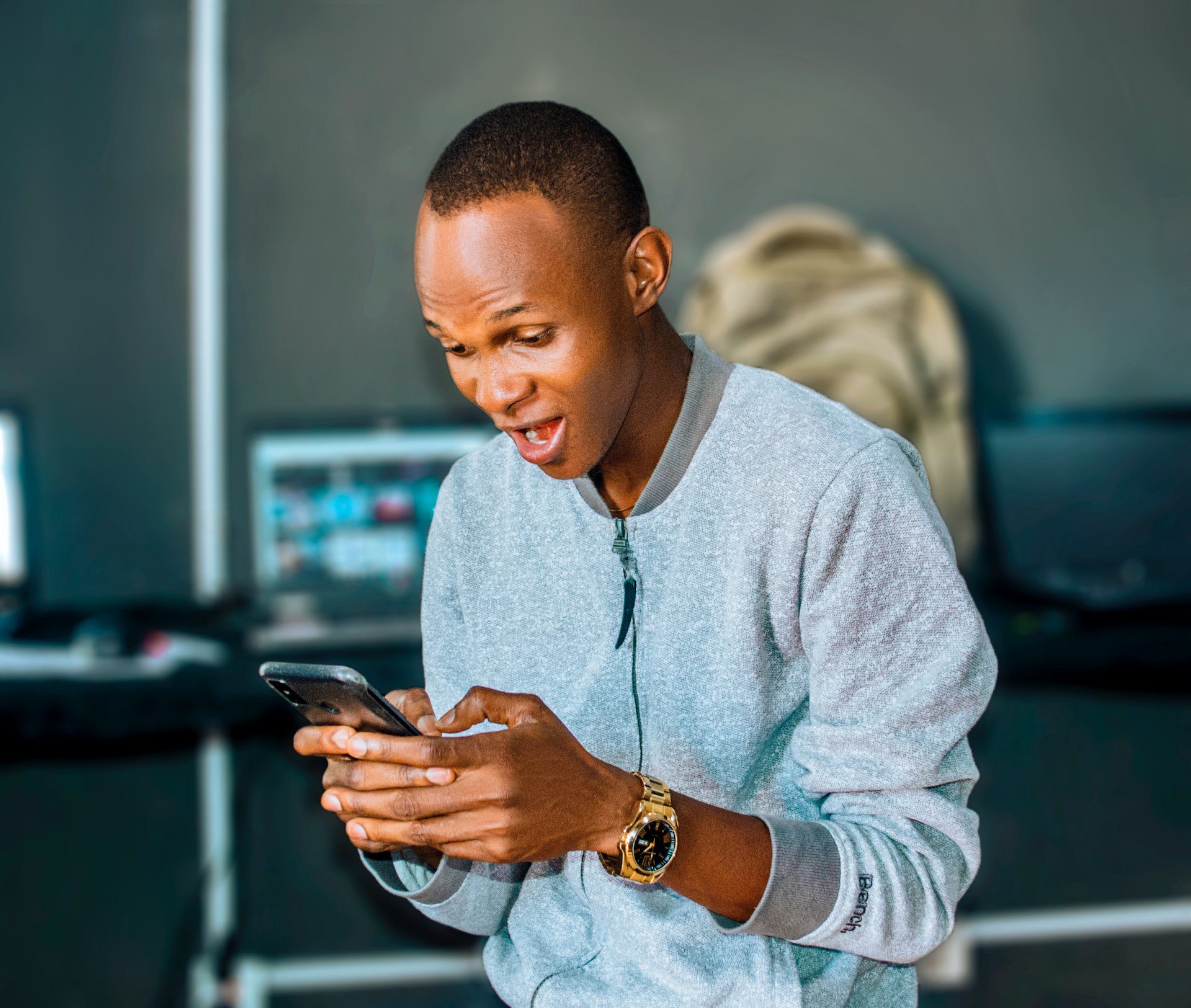 Man excited about the website on his phone